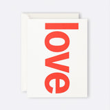 Greeting card featuring red Love typography
