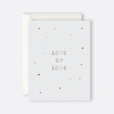Greeting card with illustrated stars and "Lots of Love" message
